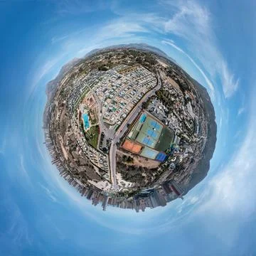 An aerial tiny planet 360 panoramic drone photo of the town of Benidorm in .. Stock Photos
