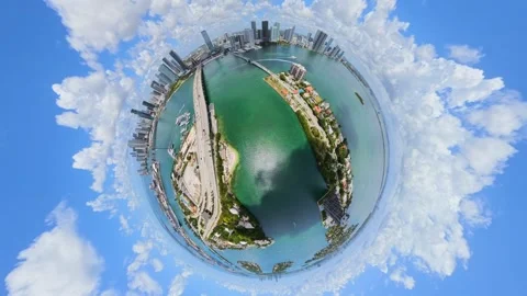 Aerial tiny planet Miami Venetian Causeway towards edgewater city view Video stock 335662790