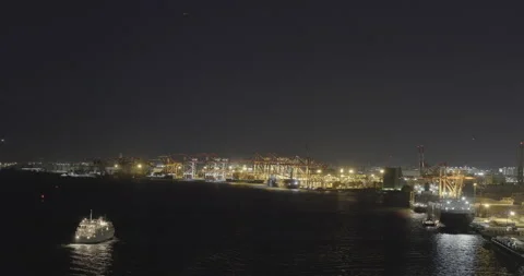 Aerial - Tokyo Bay Container terminal Cruise Ship Night View Pan RtoL Stock Footage 166326745