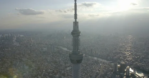 Aerial of Tokyo Skytree tower surrounded by city and river, Sumida, Tokyo Stock Footage 136099236