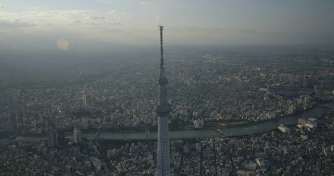 Aerial of Tokyo Skytree tower surrounded by city and river, Sumida, Tokyo Stock Footage 136100067