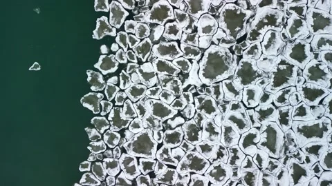 Aerial top down 4k video of interlocking ice chunks moving on Lake Ontario  Stock Footage 230097693