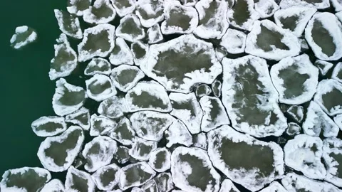 Aerial top down 4k video of interlocking ice chunks moving on Lake Ontario  Stock Footage 230097695
