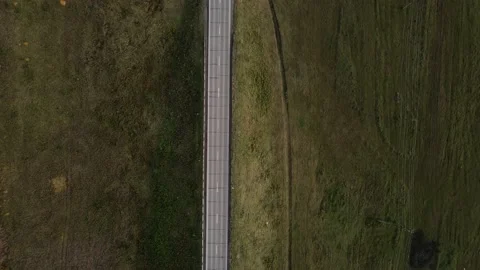 Aerial top down 4k view of car traffic driving on country road Video stock 140904515