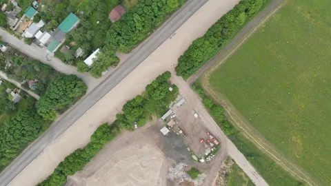 Aerial top down 4k view of a construction vehicle parking lot for road repairs Stock Footage 147460850