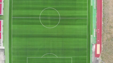 Aerial top down 4k view of football field with green lawn. Flying over sports Stock-Footage 150366745