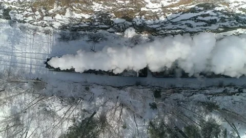 Aerial top down abstract old steam locomotive engine train rides winter railroad Stock-Footage 155668261