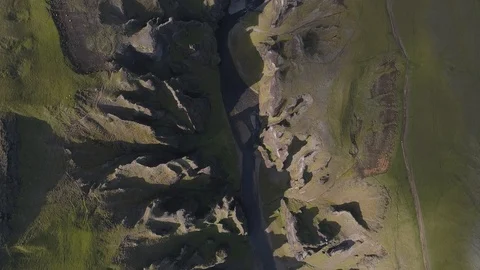 Aerial: Top down ancient massive river canyon Fjadrargljufur Iceland Stock Footage 93739410