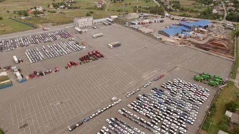 Aerial top down bird view of new car storage parking lot showing imported new Stock Footage 80120930