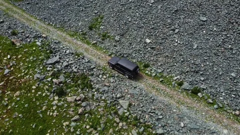 Aerial Top Down Black SUV Driving on Mountain Road Stock Footage 331654299