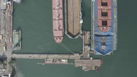 Aerial top down cargo ship in industrial shipyard. Stock Footage 132019566
