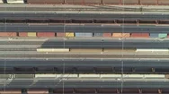 Aerial Top Down: Cargo Train Wagons Leaving Industrial Container Railway Station Stock Footage