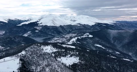 Aerial top down cinematic winter snow covered country road and picks Video stock 201491604