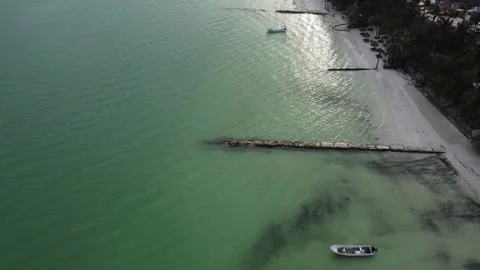 Aerial top down circular view tropical crystal clear sea water with rocks and Stock Footage 158171255