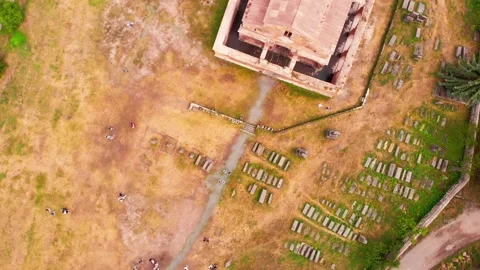 Aerial top down circular view tourists by Odzun church landmark with village  Stock Footage 164034012