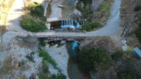 Aerial top down close up of a traditional bridge over a waterfall Stock Footage 343960913