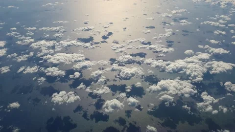 Aerial top down of clouds reflecting shadows on sea Vídeos de archivo 277520000