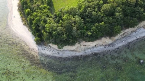 Aerial top down of coast line of Baltic Sea in Mnchgut peninsula on the isl.. 스톡 동영상 250089708