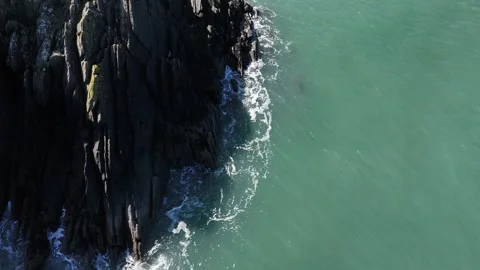 Aerial Top Down of Coastal Rocks and Calm Sea, Wales UK Stock-Footage 332076230