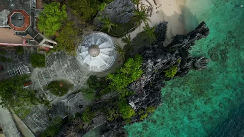 Aerial Top Down Descent Above Domed Matinloc Shrine Pavilion on Matinloc Island Vídeo Stock 337022558