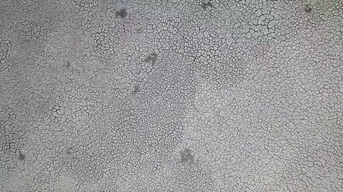 Aerial Top Down Downward Corkscrew Drone Shot Of Dry Lake / Dry Estuary. Stock Footage 268786187