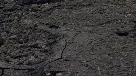 Aerial top down of dried black lava field along historic route 66 Anzac New.. Vidéo 320738840