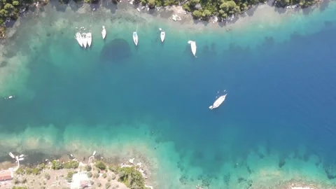 Aerial top-down drone descend over Panormos bay yachts Stock Footage 336604222