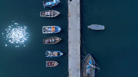 Aerial - Top down drone shot of boats docked in harbour Stock Footage 91957968