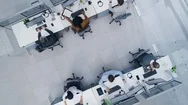 Aerial Top Down Drone Shot Of Busy Corporate Office With Two Rows Off People Stock Footage