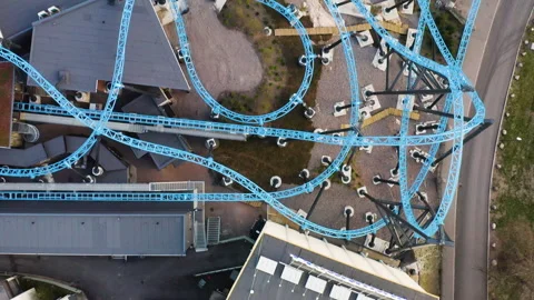 Aerial, top down, drone shot, over a roller coaster in the empty Video stock 130788973