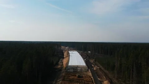 Aerial Top Down Drone Shot. Highway construction. Deforestation for a new Stock Footage 134323596