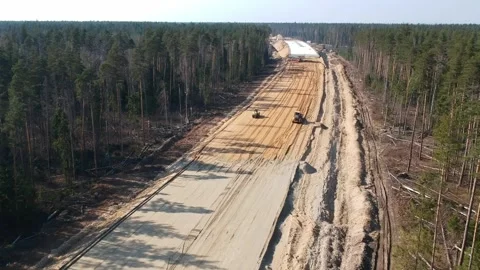 Aerial Top Down Drone Shot. Highway construction. Deforestation for a new Stock Footage 134325761