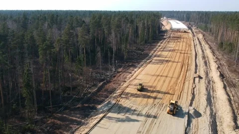 Aerial Top Down Drone Shot. Highway construction. Deforestation for a new Stock Footage 134325801