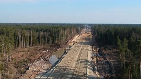 Aerial Top Down Drone Shot. Highway construction. Deforestation for a new Video stock 134325896