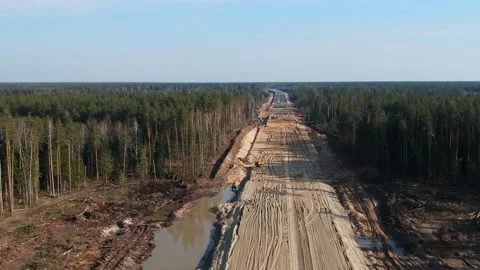 Aerial Top Down Drone Shot. Highway construction. Deforestation for a new Stock Footage 134326516