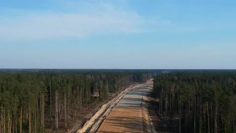 Aerial Top Down Drone Shot. Highway construction. Deforestation for a new Stock Footage 134326543