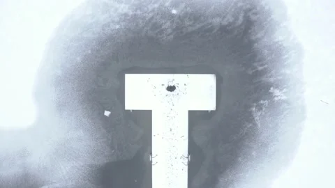 Aerial top down drone shot of person standing at the end of a snowy boardwalk Stock Footage 146295435