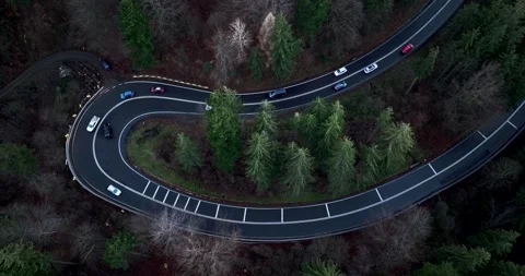 Aerial top down drone shot above the winding mountain road. Cars and trucks Video stock 201059582