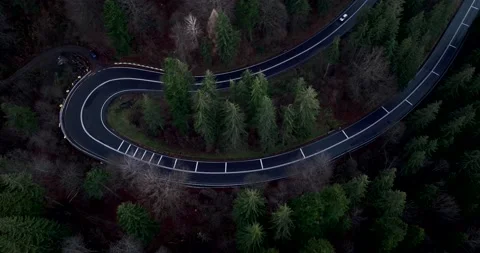 Aerial top down drone shot above the winding mountain road. Cars and trucks Video stock 201060675