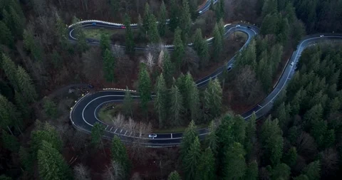 Aerial top down drone shot above the winding mountain road. Cars and trucks Video stock 201060988
