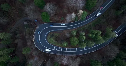 Aerial top down drone shot above the winding mountain road. Cars and trucks Video stock 201061241