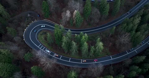 Aerial top down drone shot above the winding mountain road. Cars and trucks Video stock 201062154