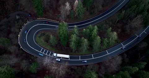 Aerial top down drone shot above the winding mountain road. Cars and trucks Video stock 201062350
