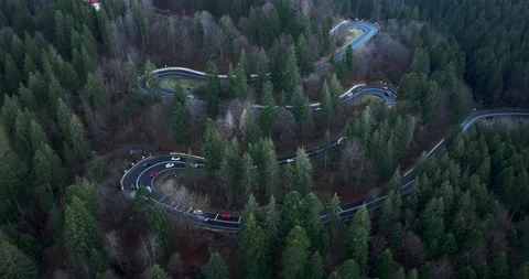 Aerial top down drone shot above the winding mountain road. Cars and trucks Video stock 201064136