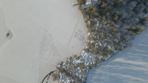 Aerial. Top Down, Drone Shot, Over A Frozen Lake With Cabine On A Sunny Day Stock Footage 224278952