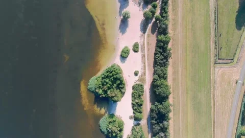 Aerial top down drone shot of a lake and a beach in Zeewolde, The Netherlands Stock Footage 230303308