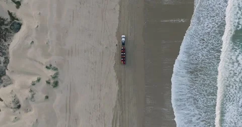 Aerial Top Down Drone shot of Truck Driving on Pismo Beach California at Sunrise Stock Footage 256955681