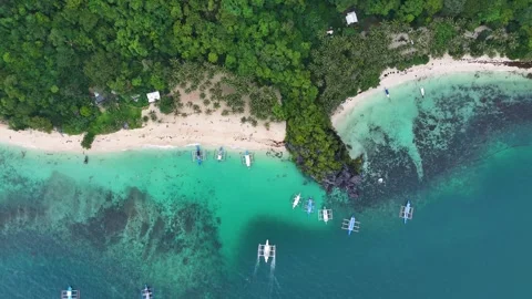 Aerial top down drone shot of a beach with crystal clear water in the ocean. Stock Footage 291635491