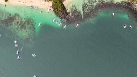 Aerial top down drone shot of boats parked in the beach Stock Footage 291636648