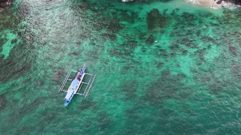 Aerial top down drone shot of a boat surfed in the ocean Stock Footage 291639457